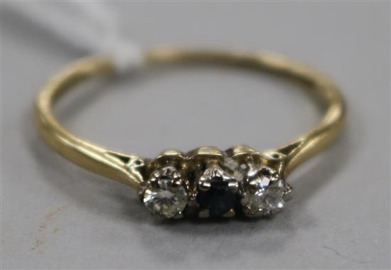 An 18ct gold, sapphire and diamond three stone ring, size Q.